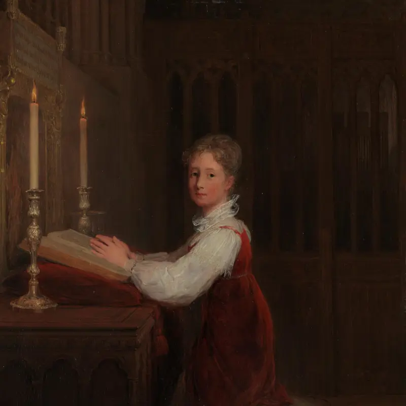 A Young Woman kneeling at a Prayer Desk
